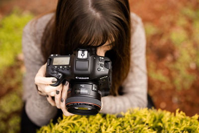 A top shot of a woman holding a camera